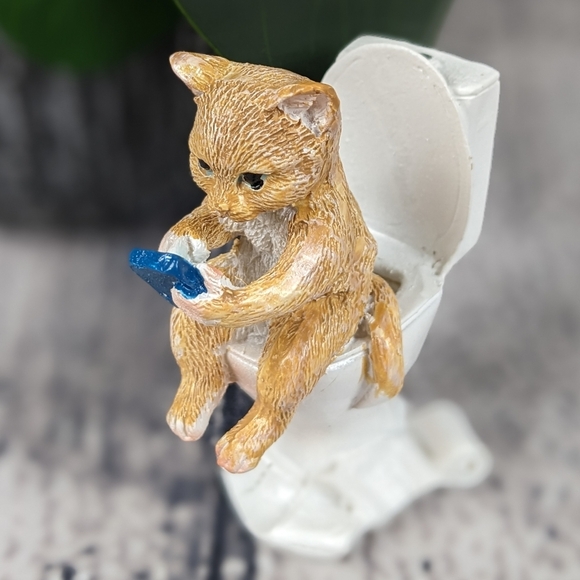 Orange ginger cat using phone while sitting on a toilet, feline statue figurine - Picture 2 of 9